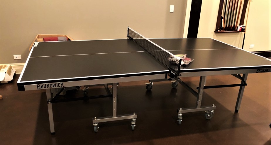 Transmotion Delivery Assembly Installation Relocation of Brunswick Billiards Smash 7.0 Table Tennis in Bannockburn IL Wisconsin Illinois Washington California Michigan Basement Friends Family Games Man Cave Fun Entertainment America Arcade Sports Healthy